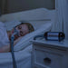 woman-in-bed-luna-travel-cpap-machine-from-react-health-westprimedirect